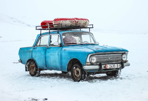 Blue Car in Snow