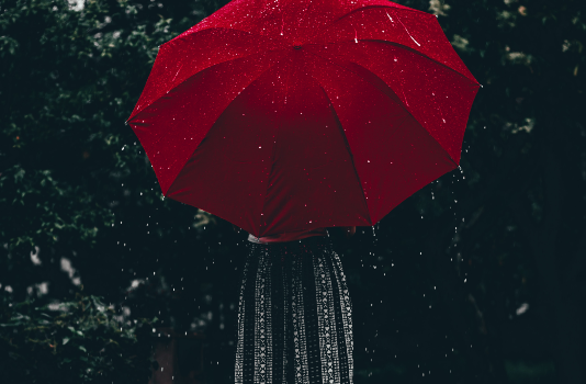 a girl with a red umbrella