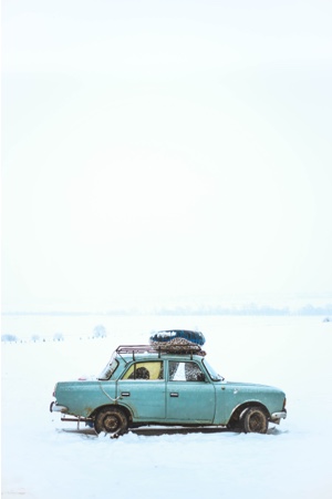a blue car in the snow